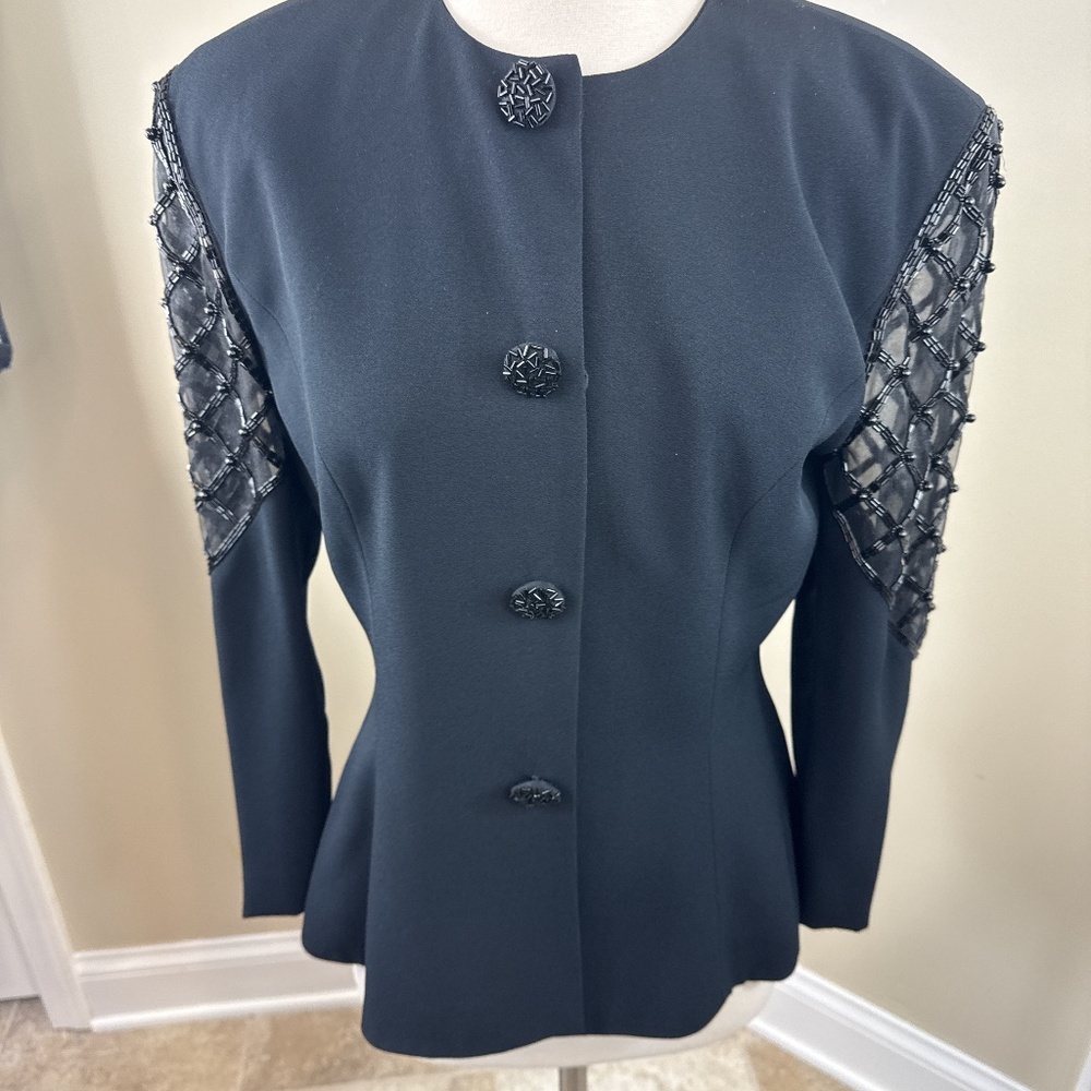 Black evening jacket with sheer sleeve and beading